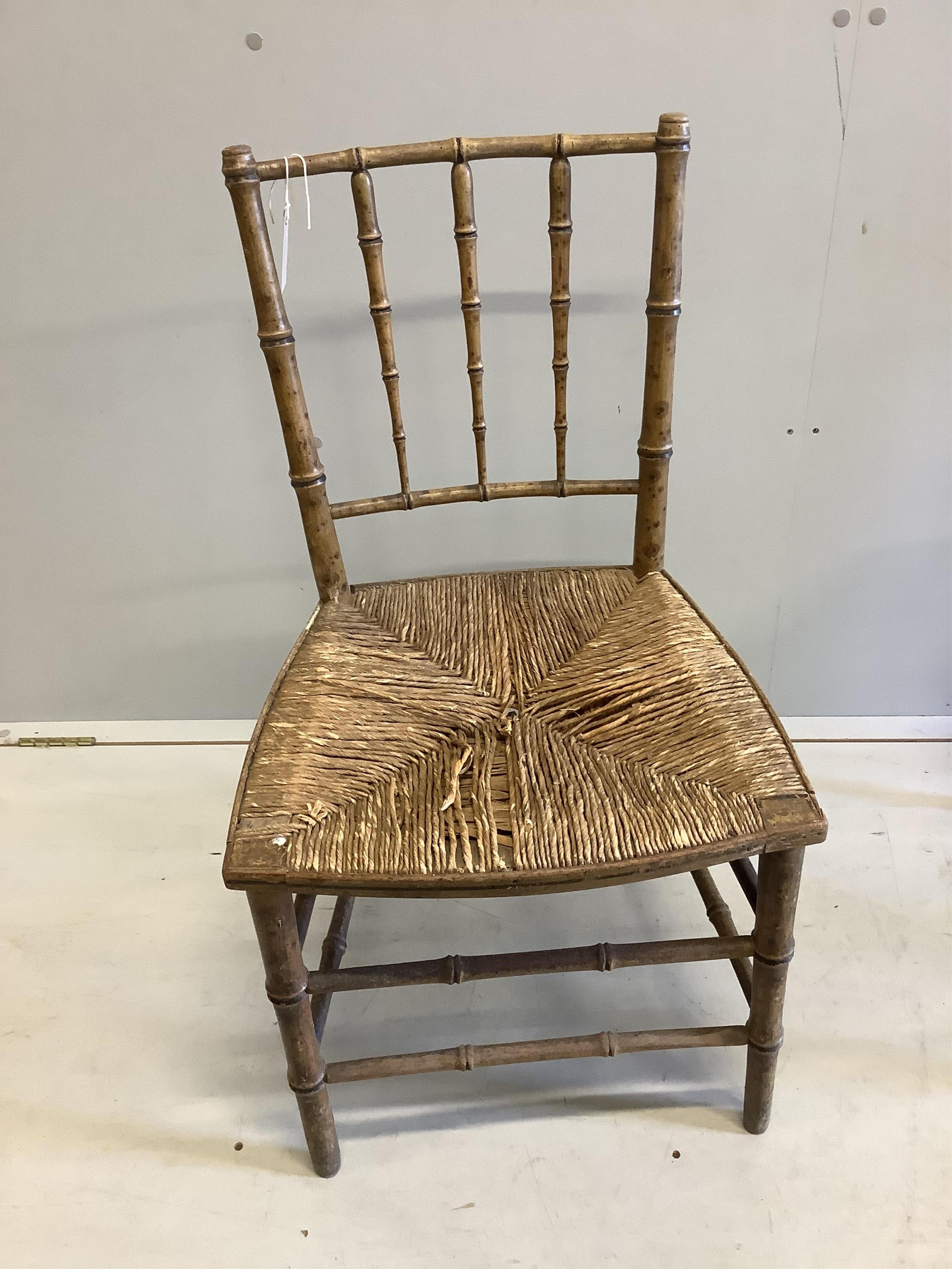 A pair of 19th century faux bamboo rush seat chairs, width 47cm, depth 40cm, height 87cm. Condition - poor